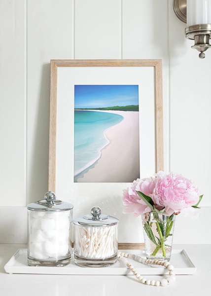 a table top vignette scene including one of mandys beach scenes in a small framed print