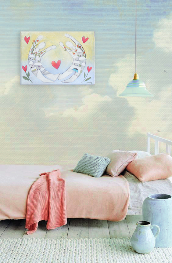 An interior design scene. A bedroom in light pastel colours with clouds painted on the wall - and one of Mandys original paintings of two people flying in the sky hanging on the wall 