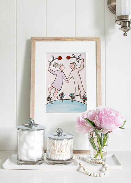 the same light coloured display including a small framed print of two lovers flying in the air holding roses