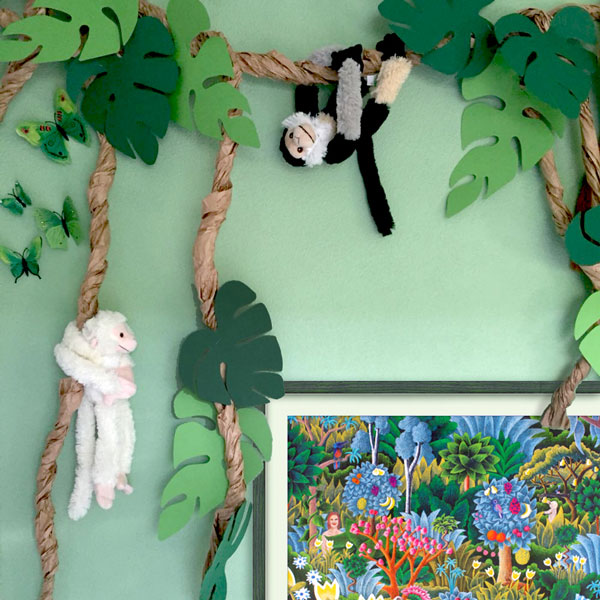 the limited edition print of the jungle picture in a kids room with stuffed monkeys