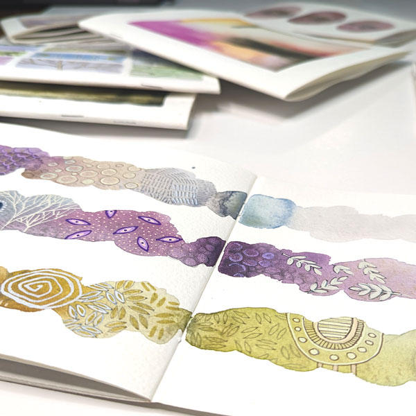 notebooks covered in gorgeous abstract watercolour art